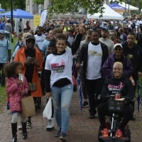A group of people walking in a marathon.