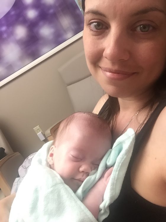 Mother holding a premature baby at the hospital