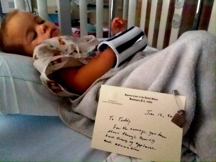 author's son in a hospital bed with a note from Ruth Bader Ginsburg