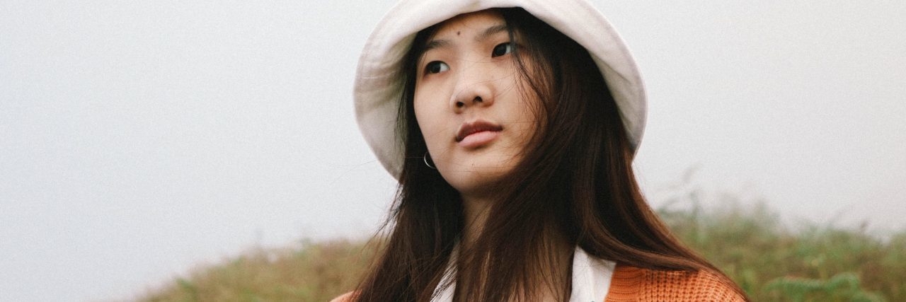 How Borderline Personality Disorder Makes College Difficult young asian woman looking into distance