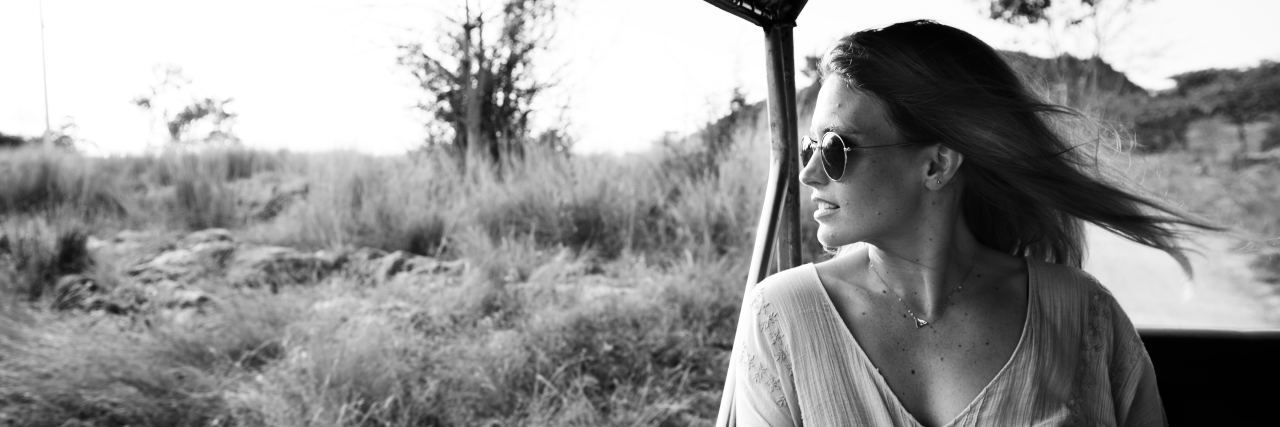 4 Reasons Why Travel Won't 'Cure' My Depression black and white image of woman on safari