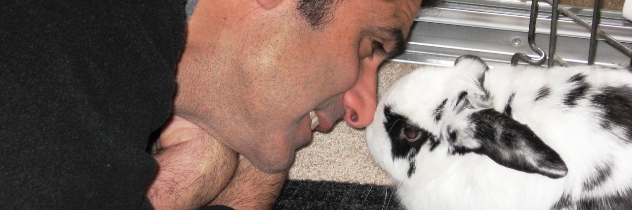 man kissing his bunny