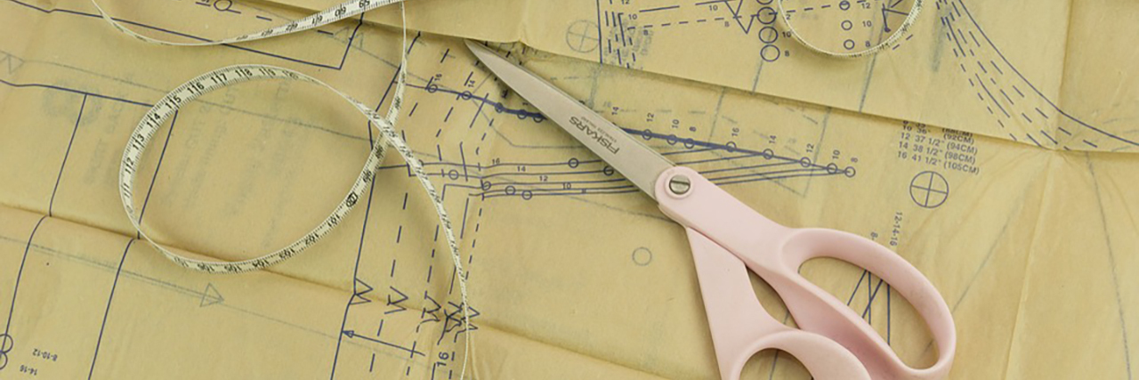 Creating Accessible Fashion for People With Disabilities Clothing pattern, scissors and measuring tape.