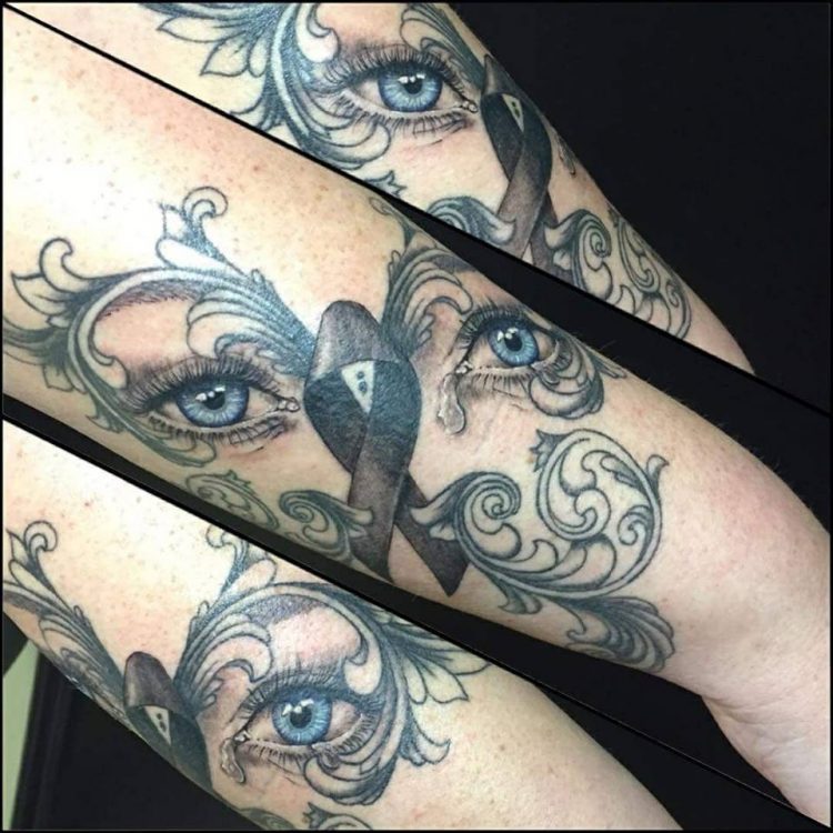 tattoo of eyes on arm