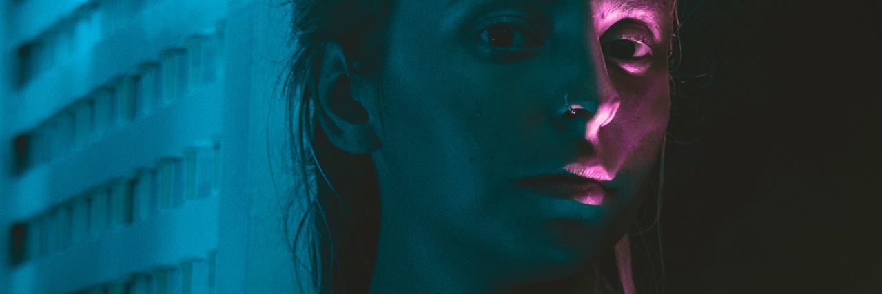 I Gained and Lost a Borderline Personality Disorder woman with sliver of pink light covered eye