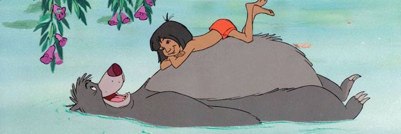 Baloo laying in a river with Mowgli sitting on his belly. From "The Jungle Book" movie