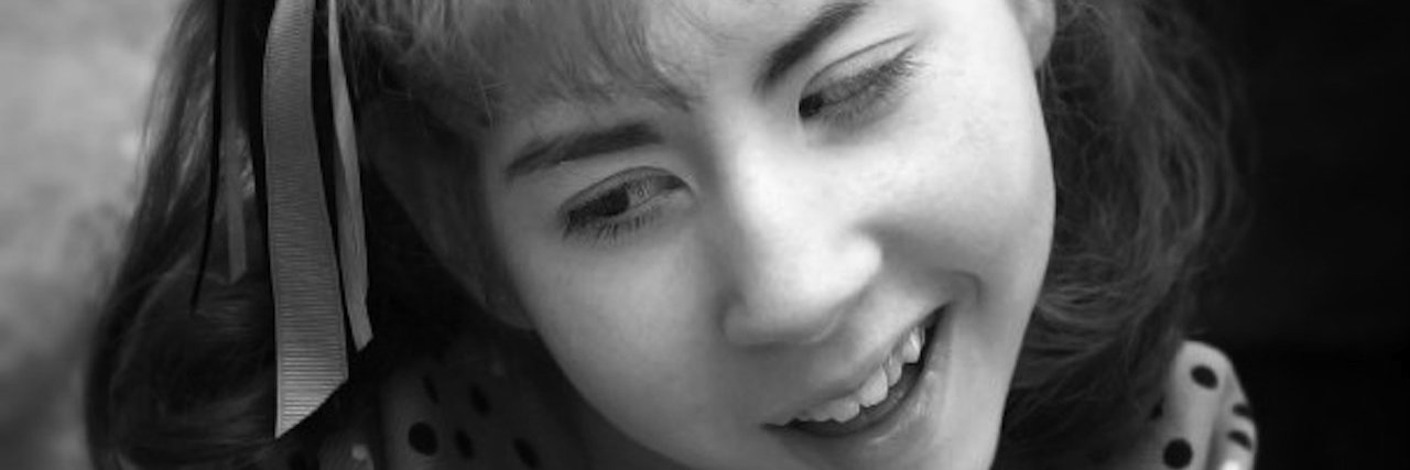 Why I Appreciate International Bereaved Mother's Day A young girl smiling.