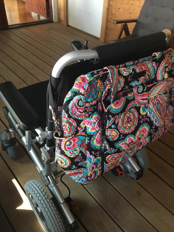 wheelchair with flowered backpack