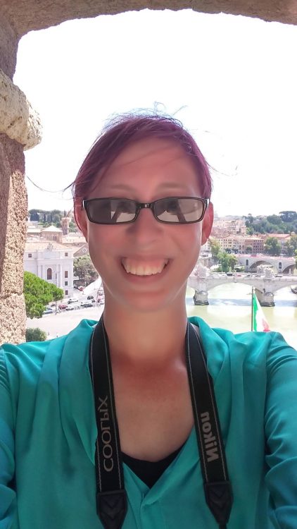 woman on bridge wearing sunglasses