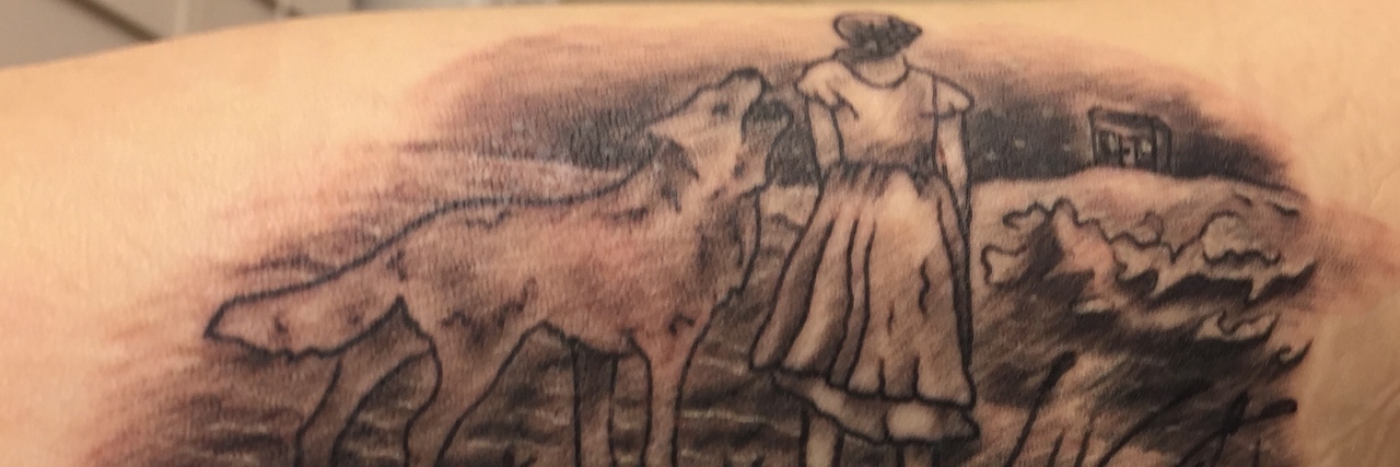 What a 'Safe Song' Means to Someone With PTSD tattoo of woman and wolf with tom walker lyrics from Leave a Light On