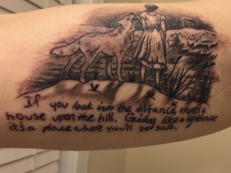 tattoo of woman and wolf with tom walker lyrics from Leave a Light On