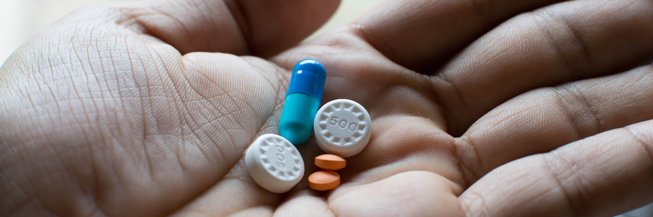 What I Wish People Knew About Medication Compliance a hand holding pills