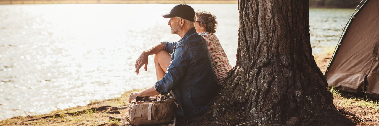 Why We Try to Fight the Chronic Illness 'Can’ts' Mature couple relaxing at their campsite.