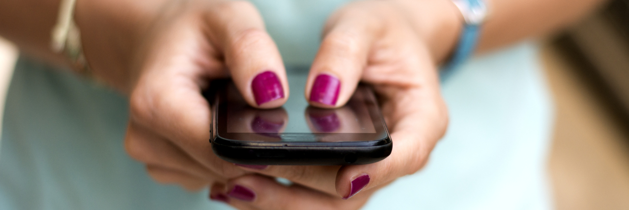 Reaching New Milestones in the Stuttering Journey girl holding smart phone