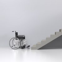 Wheelchair in front of stairs.