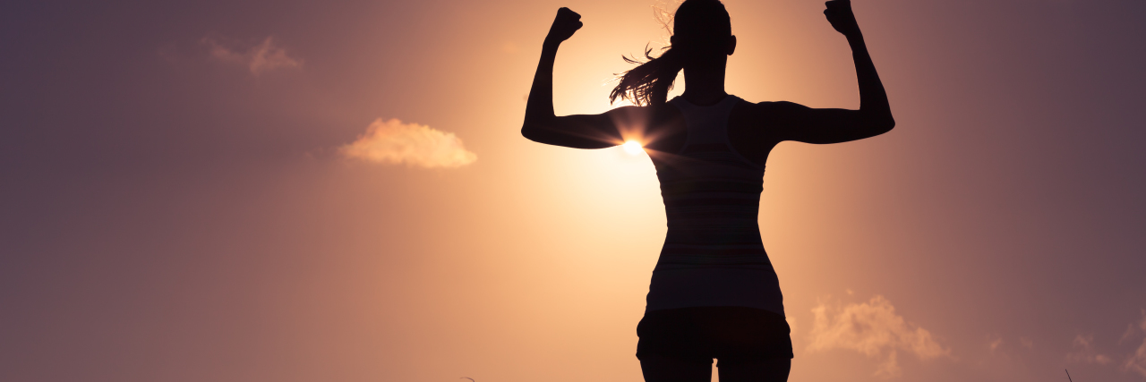 I Survived Breast Cancer, We're All Survivors A woman flexing her arm muscles