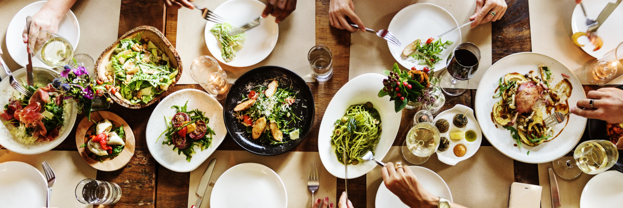 When My Colleague Decided to Bring My Family Dinner Each Week plates of food on a table, hands reaching and eating