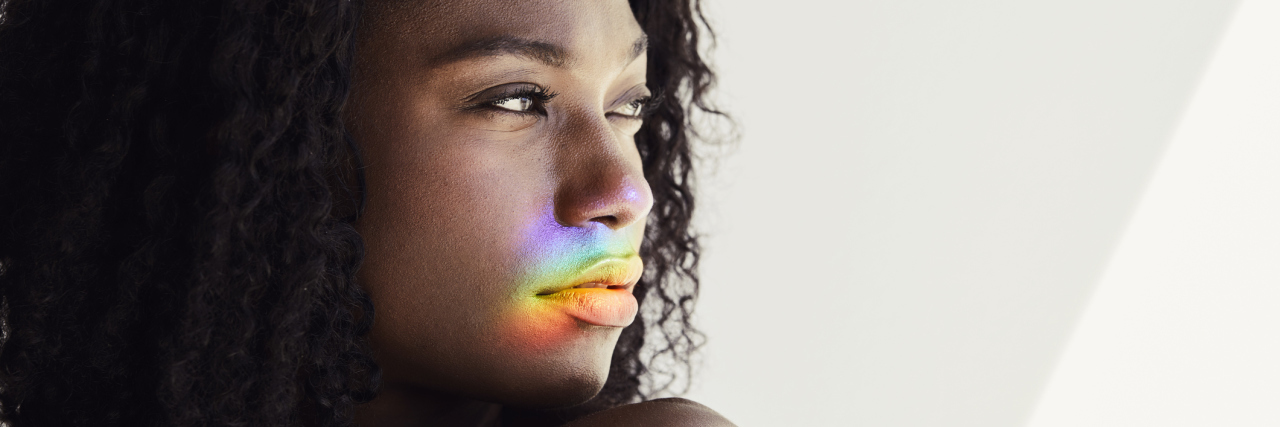 7 Difficult Truths About Fibromyalgia A woman looking towards her left, showing a serious and thoughtful facial expression.