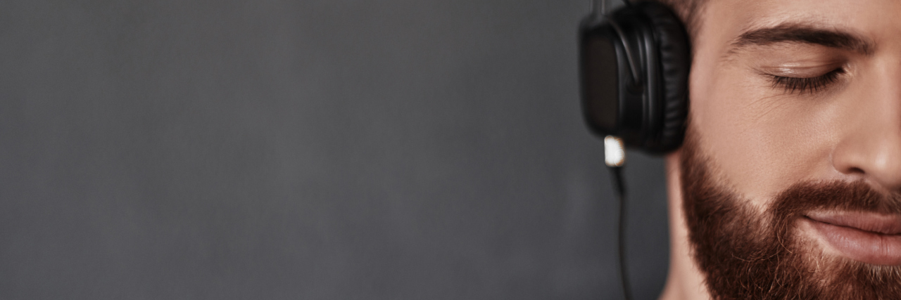 How Music Helps Me Cope With Chronic Pain From Fibromyalgia man listening to music