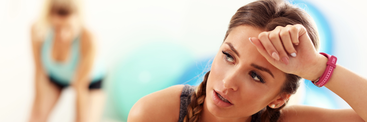 Finding That Sweet Spot Between Exercise and CFS A pictureo f a woman tired while exercising.