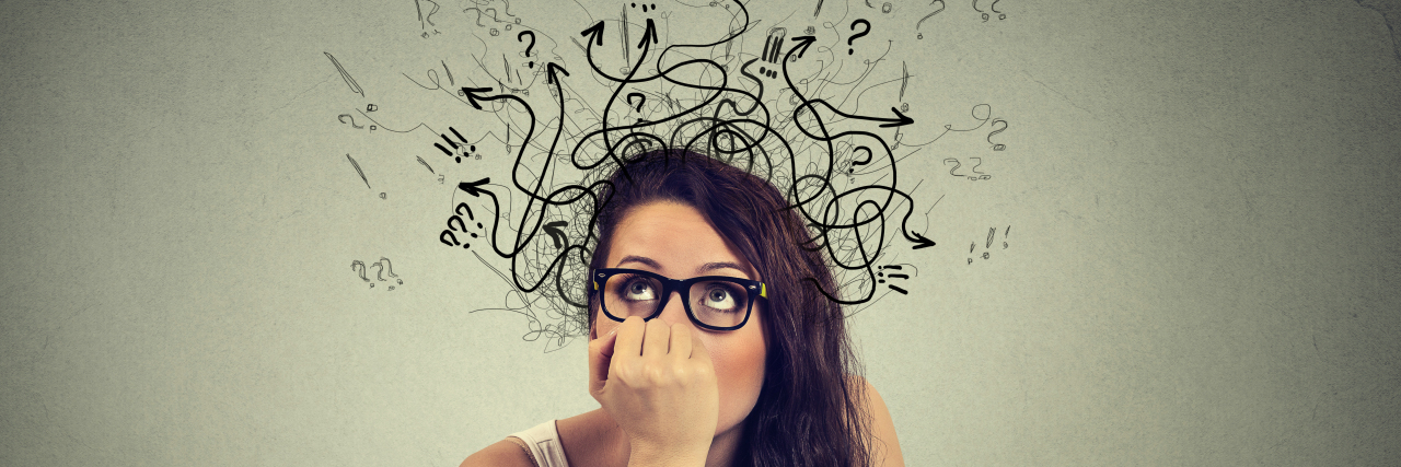 I Got 99 Problems but a Twitch Ain't One Woman with thoughtful expression sitting at a desk with laptop with lines arrows and symbols coming out of her head.