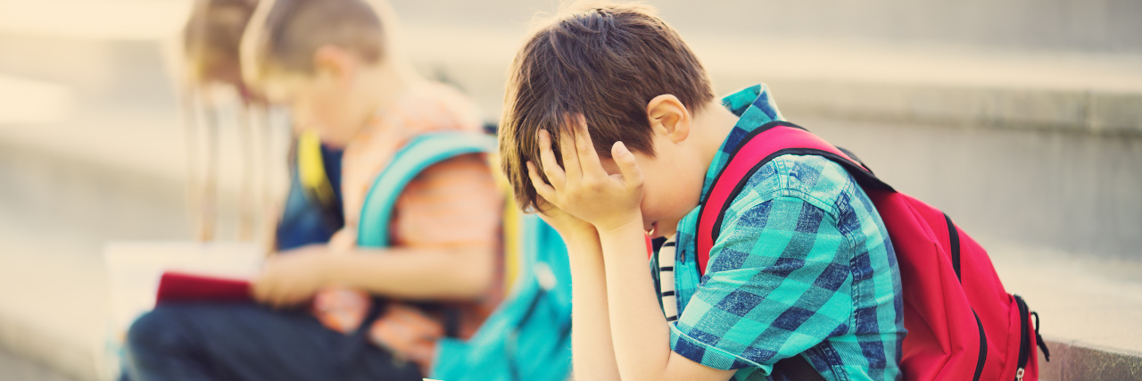 How School Transitions Affect Students With Autism Stressed out children at school.