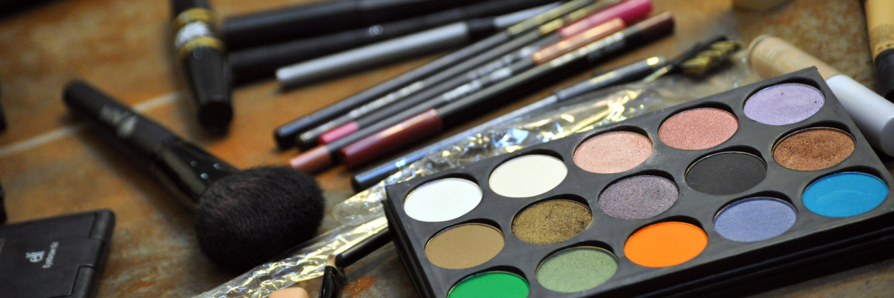 Why I View Makeup as War Paint That Prepares Me for My Medical Battle A picture featuring makeup on a counter.