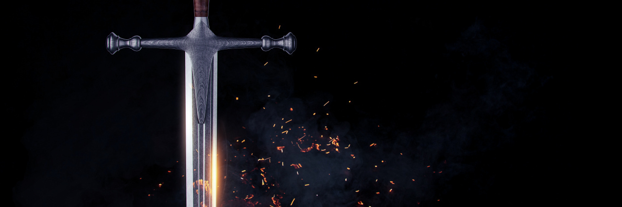 Metal sword on a dark background.
