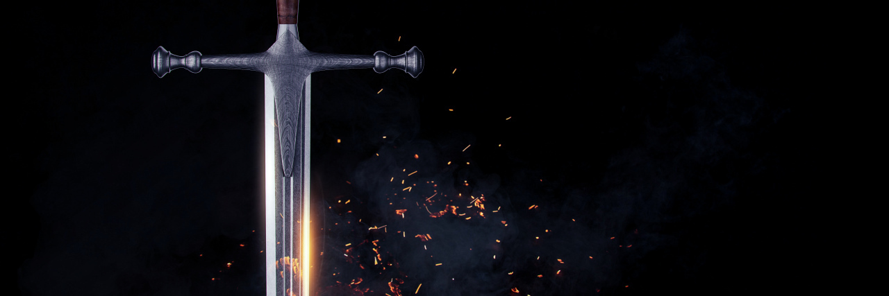 Defining Disability: a Many-Edged Sword Metal sword on a dark background.