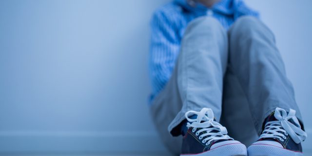 a young boy sitting