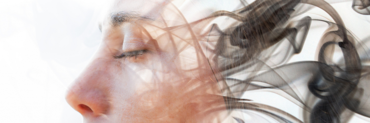Seeing Things Others Don't: A Patient's Guide to Hallucinations in Parkinson's double exposure portrait of a woman with her eyes closed, and the photo fades into wisps