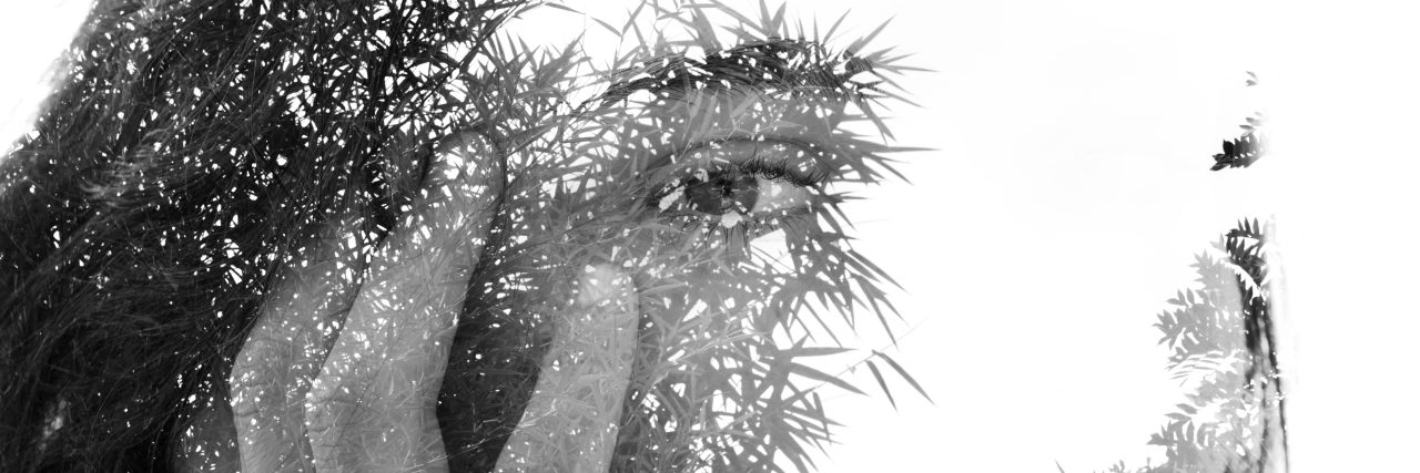 The Things You Don't See About My Life With an Invisible Disability Double exposure portrait of a woman, black-and-white.