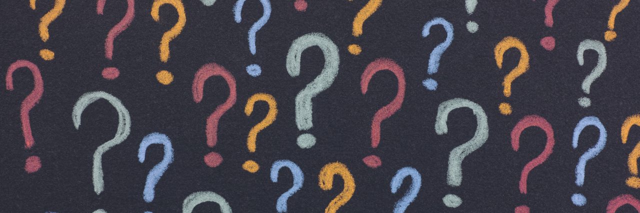 Colorful question marks on a black background.