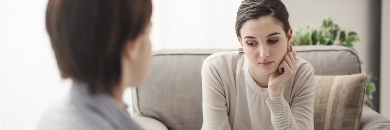 A young female talking to a therapist.