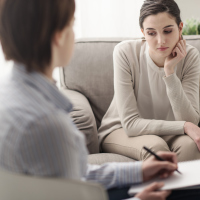 A young female talking to a therapist.