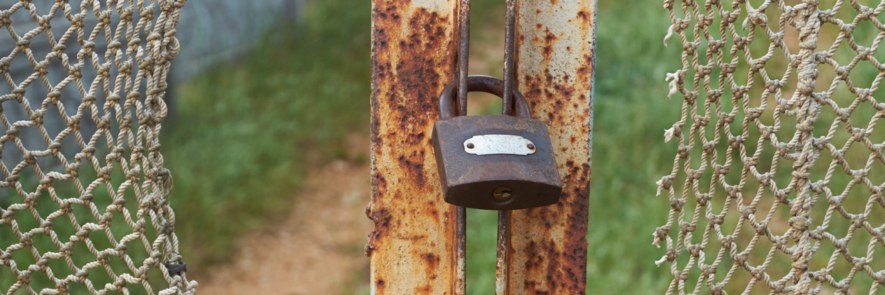 The Hole in the Chain Link Fence of Awareness Campaigns A vintage, old chain link fence with gaps.