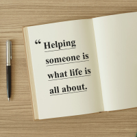 A notebook with an inspirational quote about helping people.