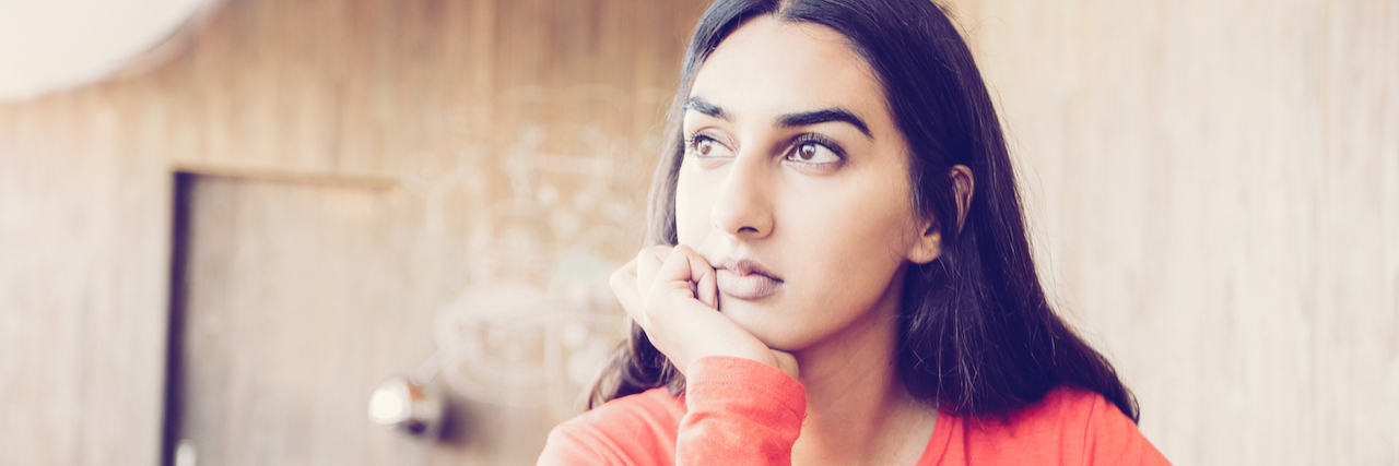 A Student Struggling With Depression at a Coffee Shop girl sitting in a coffee shop