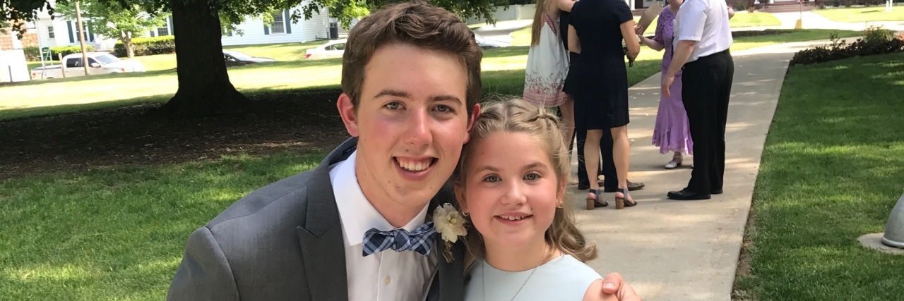 Tommy Shoemaker at a wedding with a young relative.