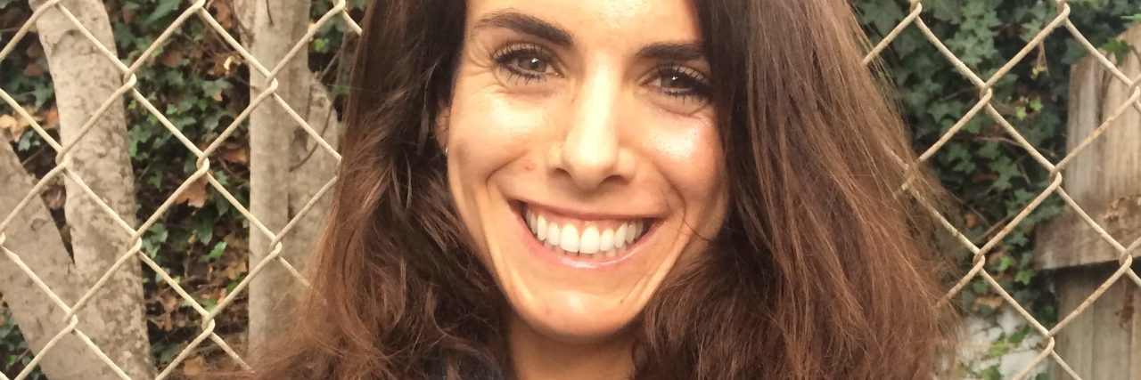 Read This If You Doubt Eating Disorder Recovery Is Possible woman wearing denim jacket smiling into camera