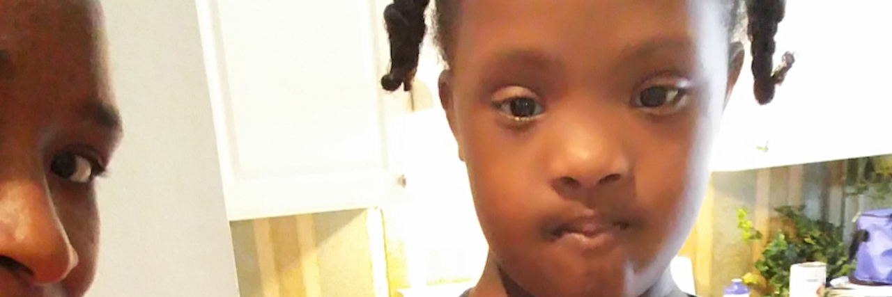 What 'Independence Day' Means for My Daughter With Down Syndrome Little girl with Down syndrome holding a mixer