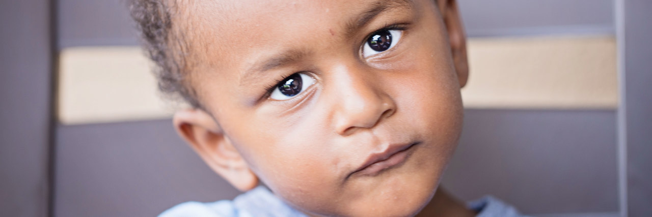 the author's child looking into the camera