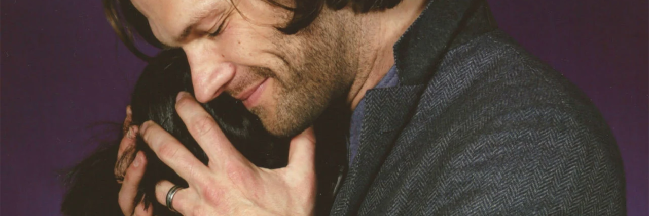 Why Anxiety Makes It Hard for Me to Be in Pictures contributor with jared padalecki from tv show supernatural where contributor is hiding her face in his shoulder