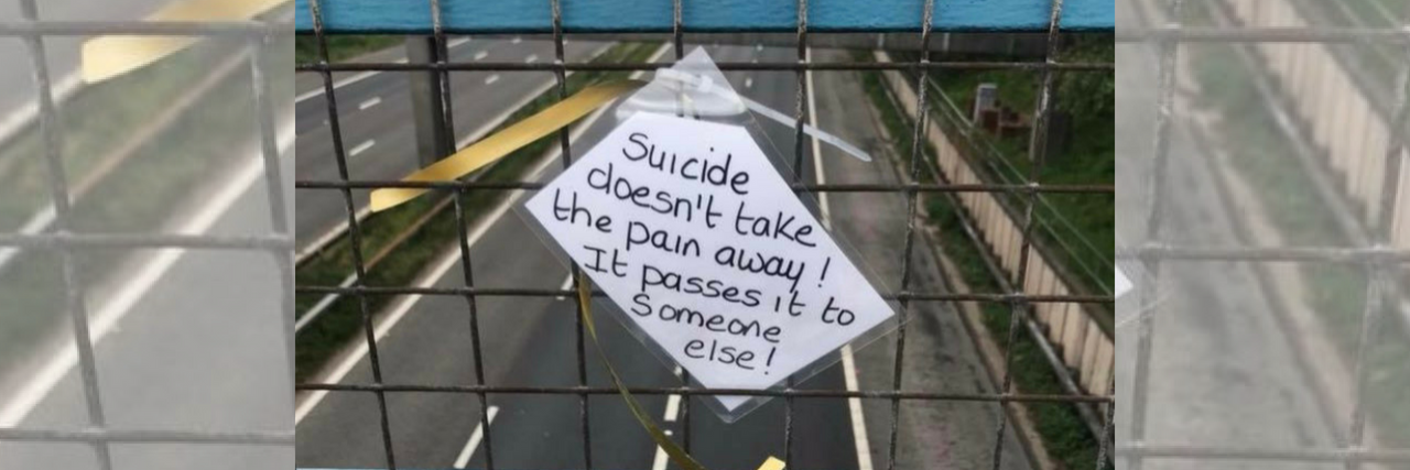 Why 'Suicide Doesn't Take the Pain Away' Isn't Helpful A piece of paper taped on a bridge with a suicide prevention quote