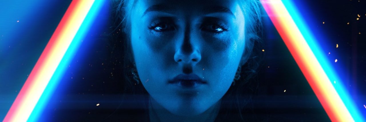 What to Say to a Friend Who Opens Up About Experiencing Hallucinations young woman surrounded by light prisms