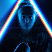 young woman surrounded by light prisms