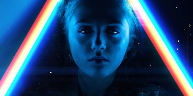 young woman surrounded by light prisms