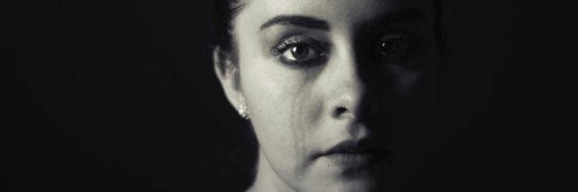 woman crying black and white photo