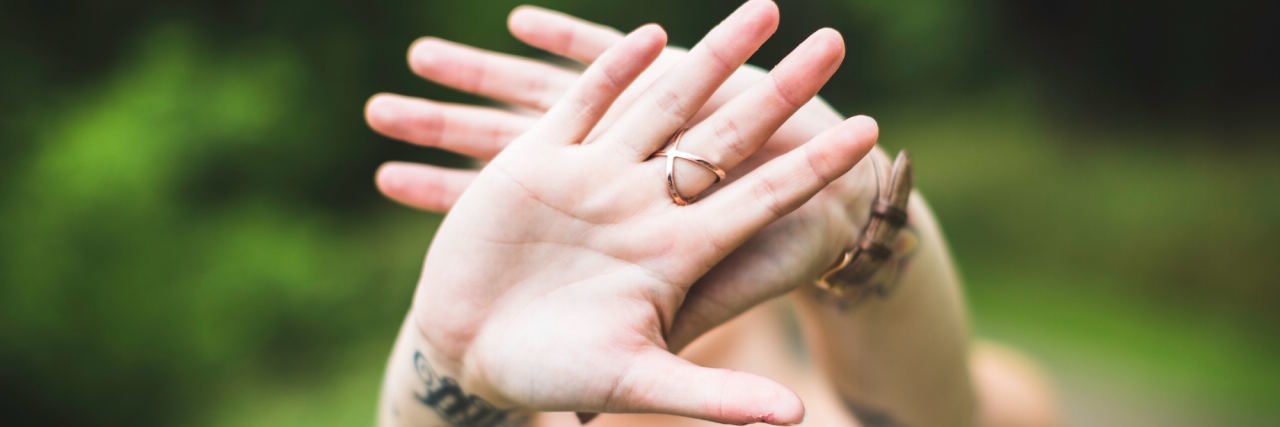 Depression Makes Me Feel 'Ugly' woman face hidden by hands