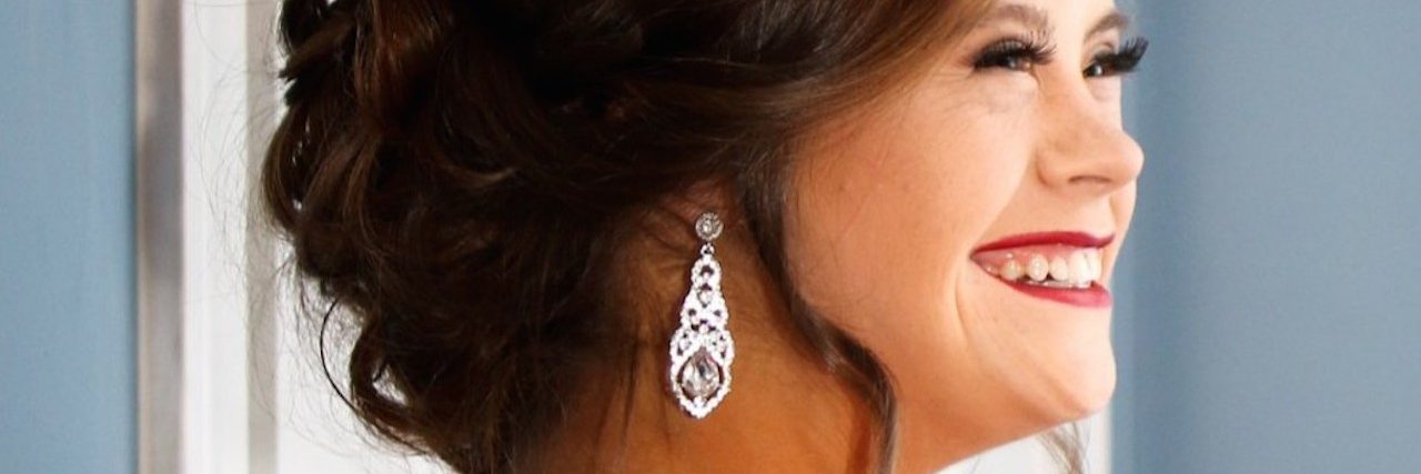 Anna Sikes Is Showing There's Nothing 'Down' About Down Syndrome woman with down syndrome in red dress